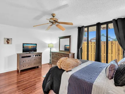a bedroom with a bed and a television