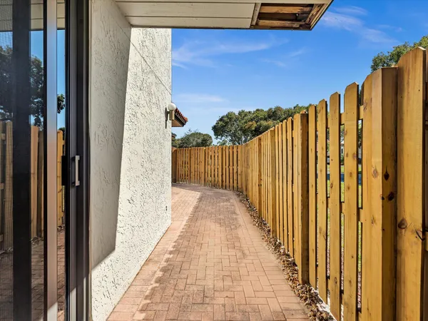 a view of a wooden door with a balcony