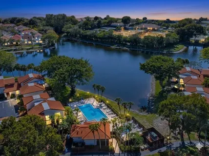 an aerial view of houses and lake