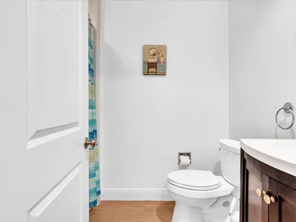 a bathroom with a sink a toilet and a shower