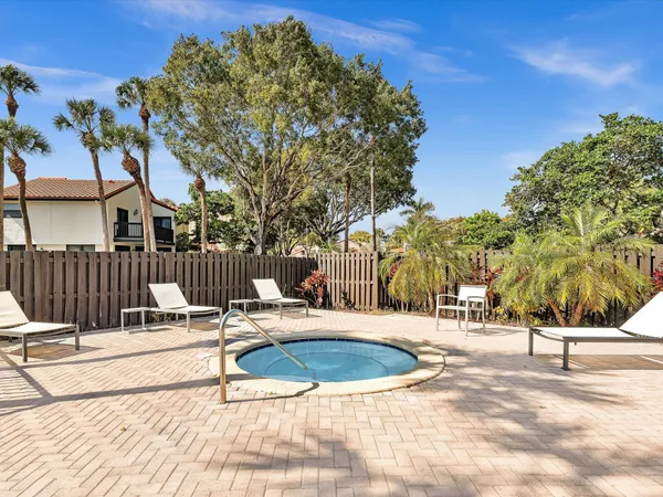 a view of a swimming pool with a patio