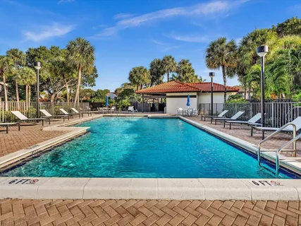 a view of a patio with swimming pool