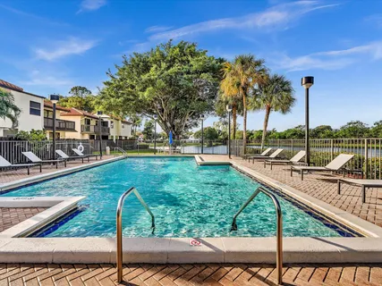 a view of a swimming pool with a patio
