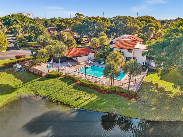 an aerial view of a house with a yard basket ball court and outdoor seating