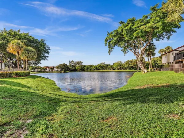 a view of a lake with houses in the back