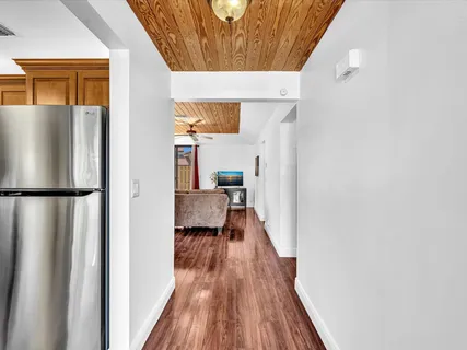 a view of living room with furniture and wooden floor