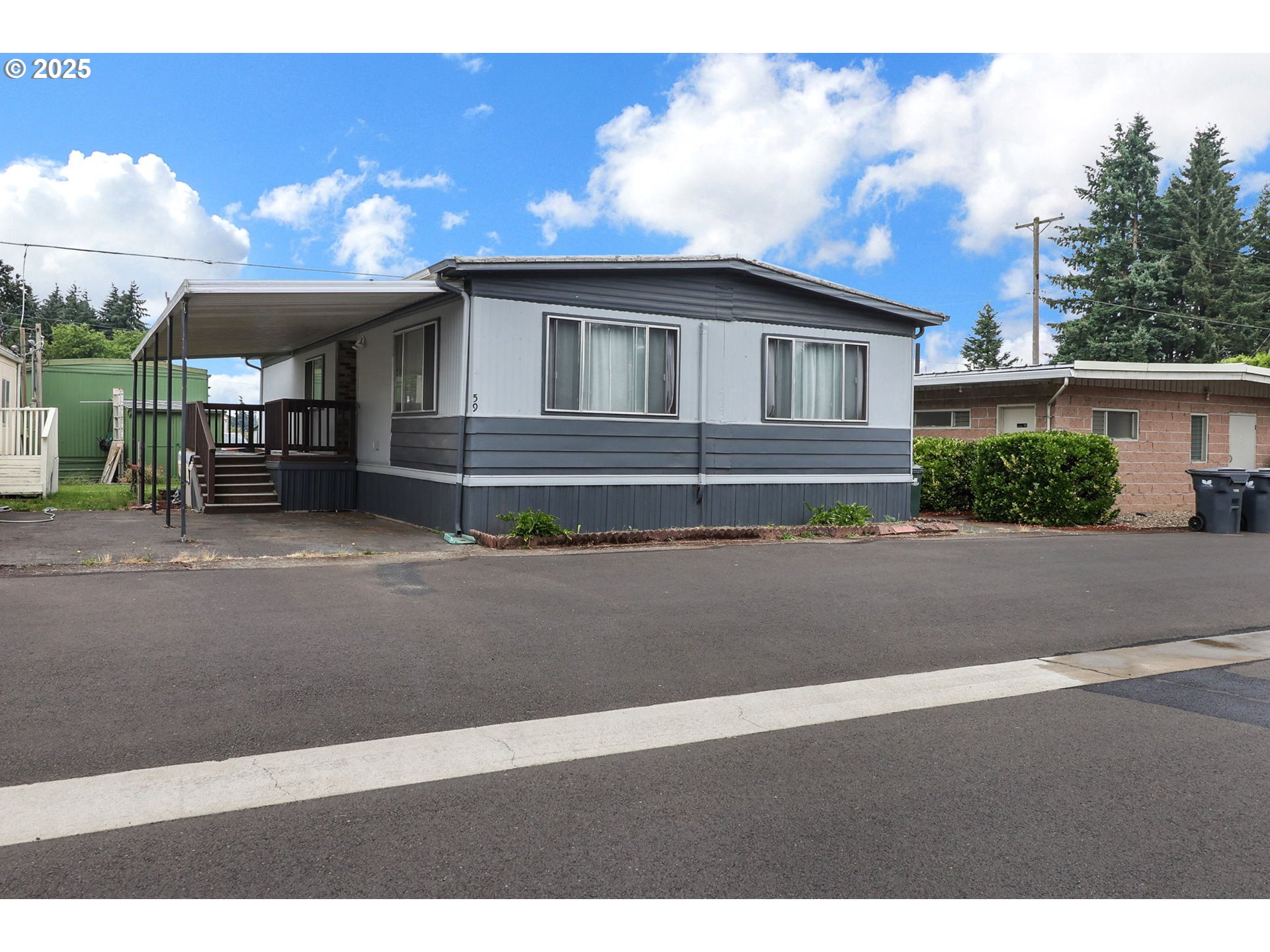 3900 Coburg Road, Unit 59 Eugene, OR 97408 - Photo 1 of 30 a front view of a house with a garden
