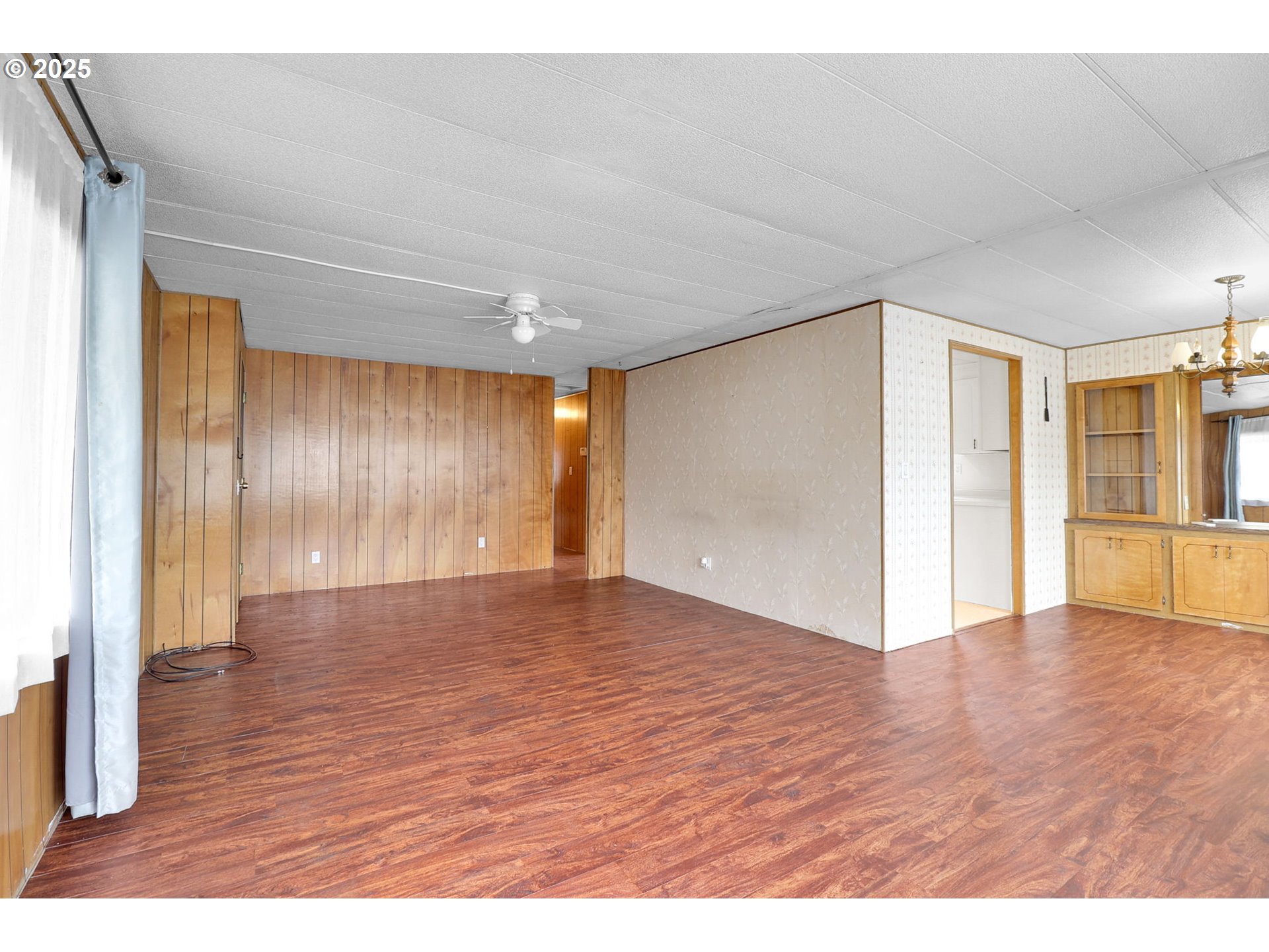 3900 Coburg Road, Unit 59 Eugene, OR 97408 - Photo 12 of 30 a view of an empty room with wooden floor
