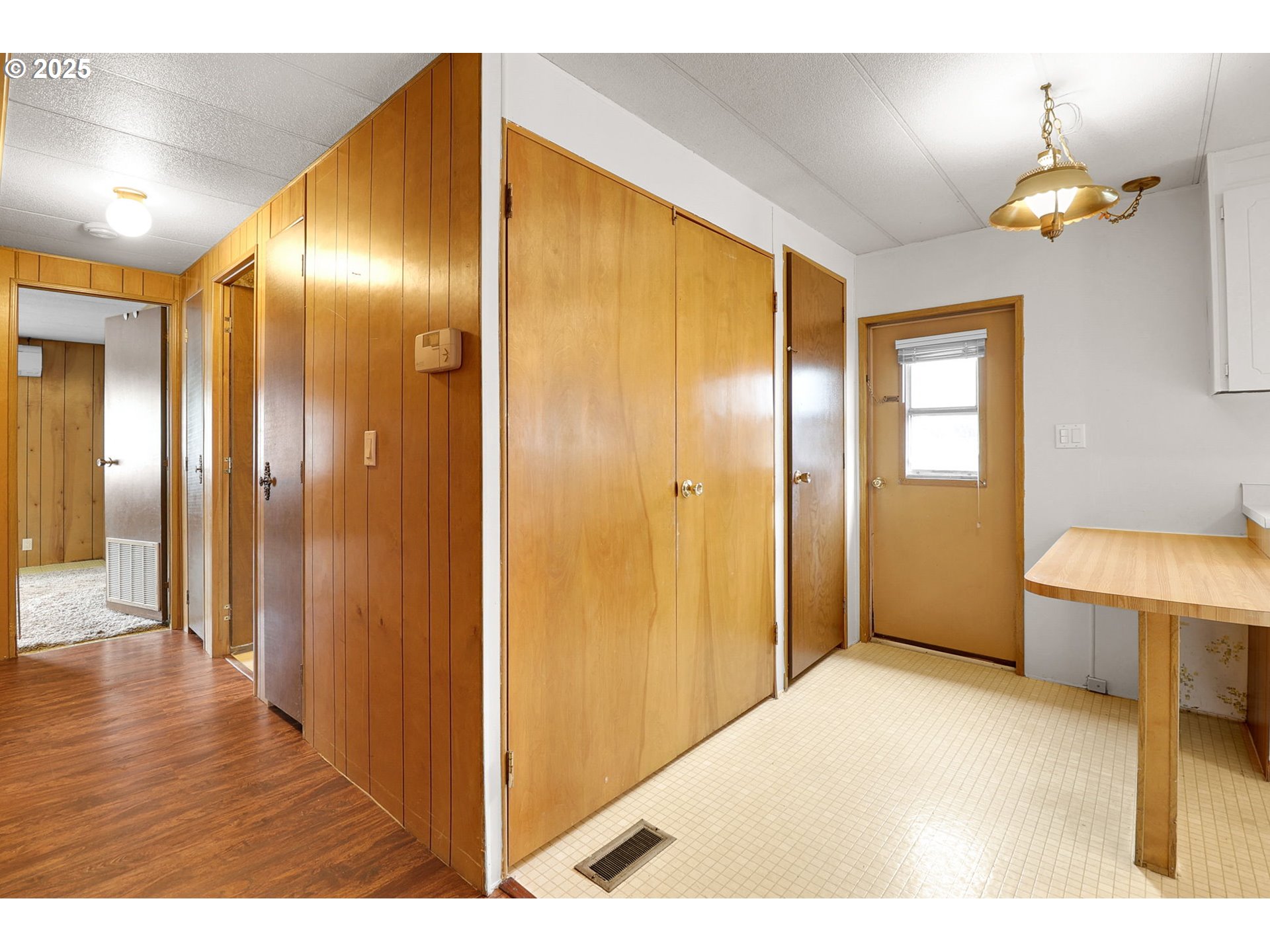 3900 Coburg Road, Unit 59 Eugene, OR 97408 - Photo 13 of 30 a view of a big room with wooden floor windows and kitchen view