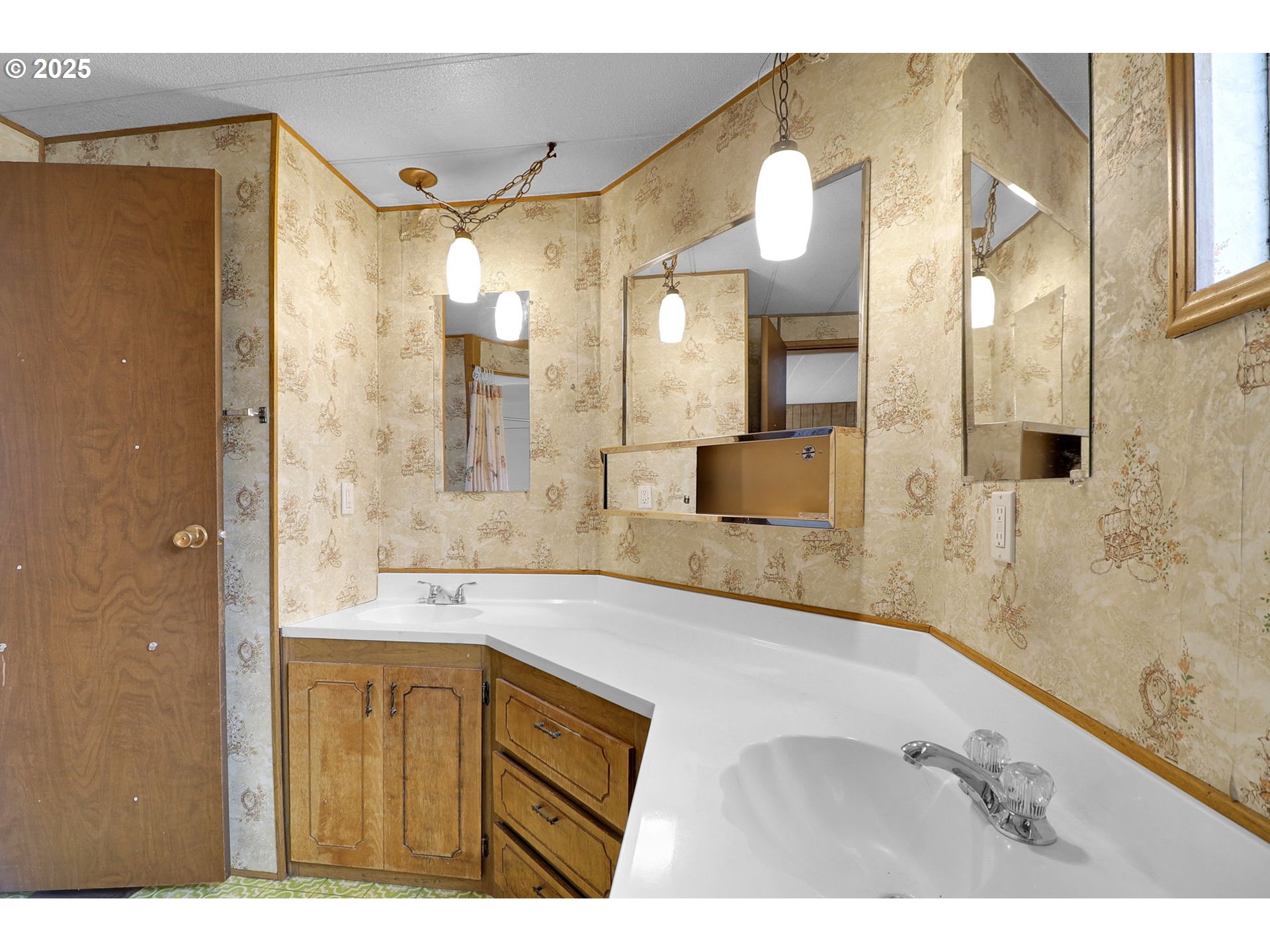 3900 Coburg Road, Unit 59 Eugene, OR 97408 - Photo 21 of 30 a bathroom with a sink a mirror and a shower