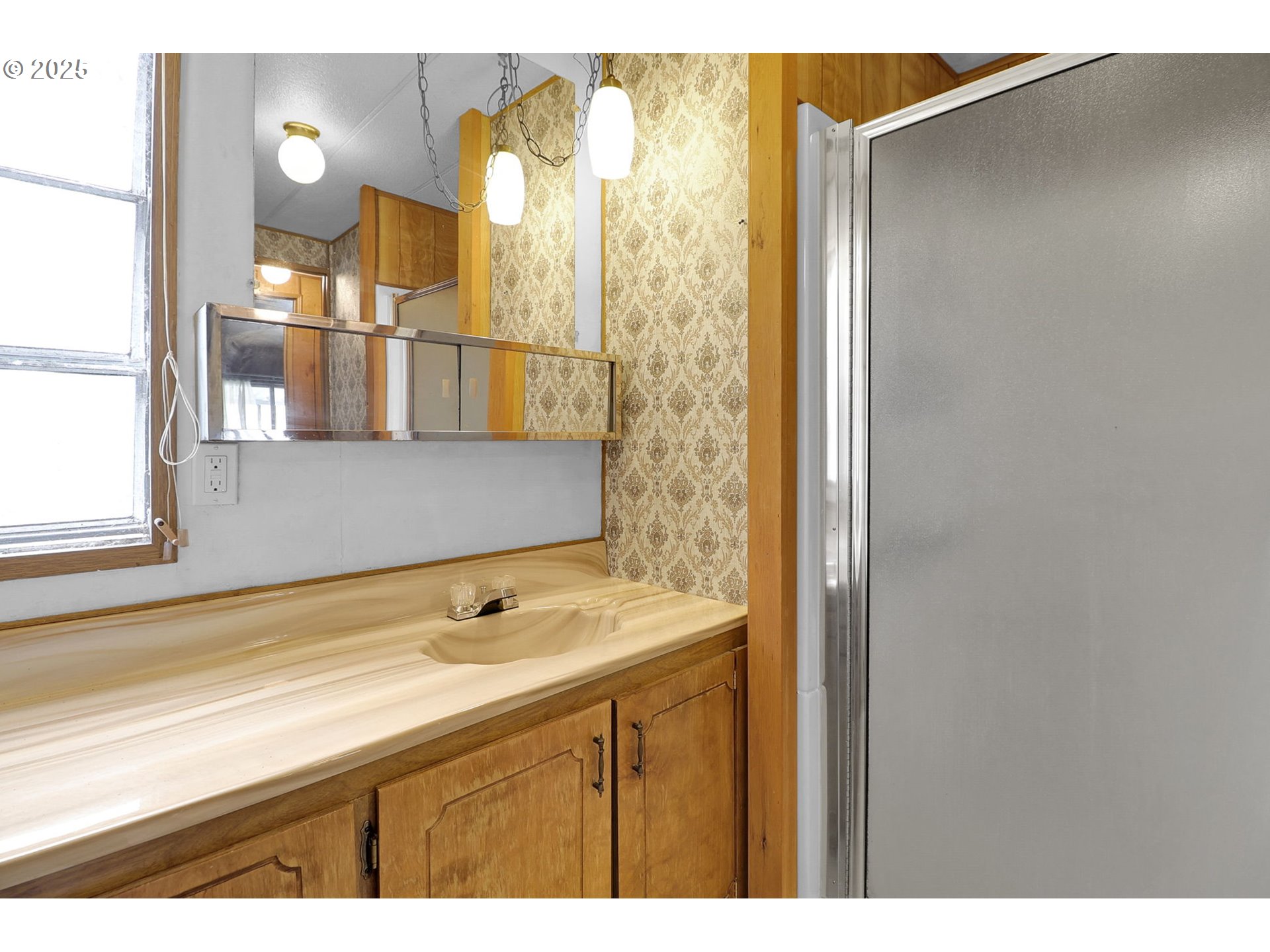 3900 Coburg Road, Unit 59 Eugene, OR 97408 - Photo 23 of 30 a bathroom with a sink and a mirror
