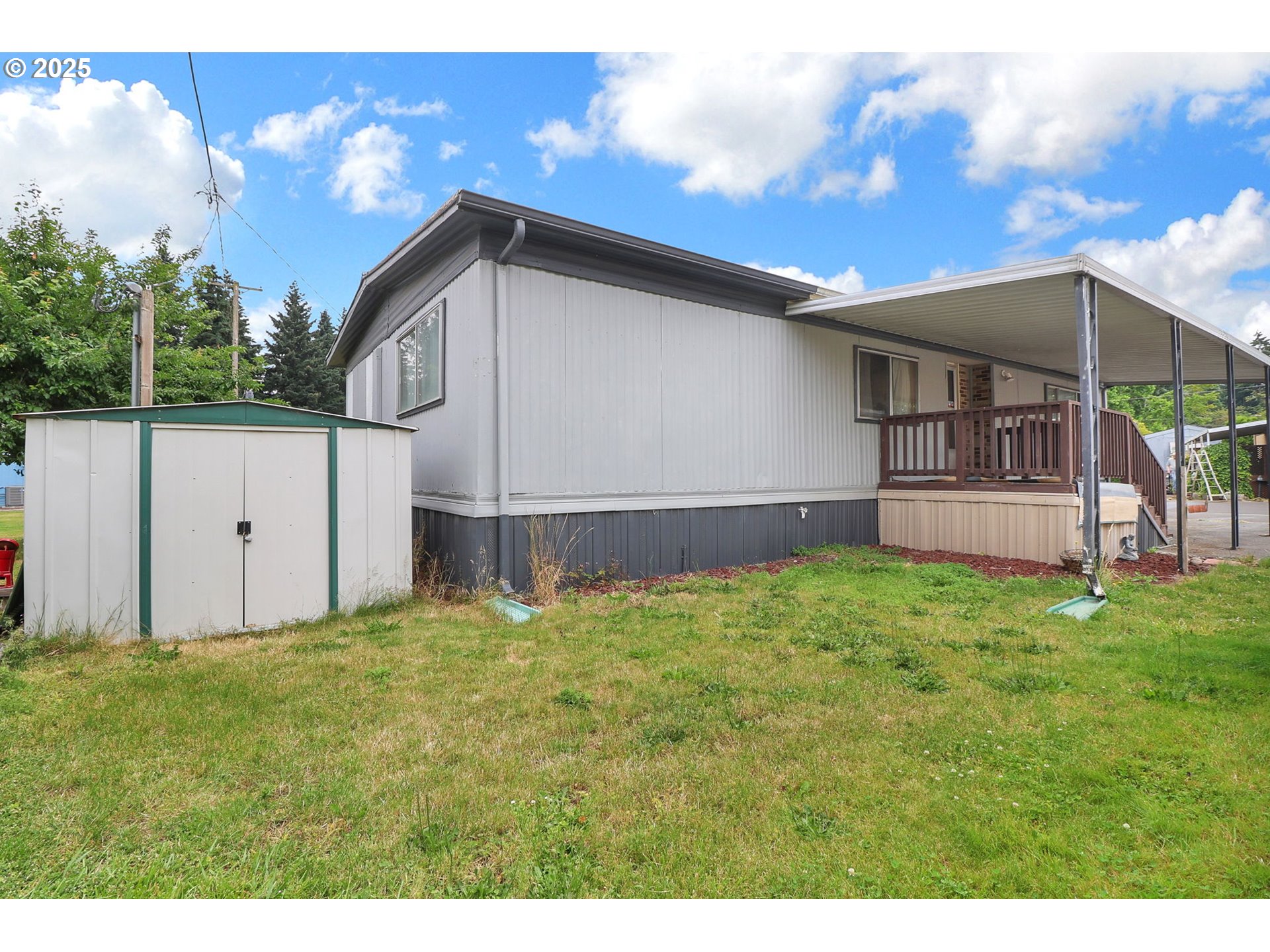 3900 Coburg Road, Unit 59 Eugene, OR 97408 - Photo 27 of 30 a house with green field in front of it
