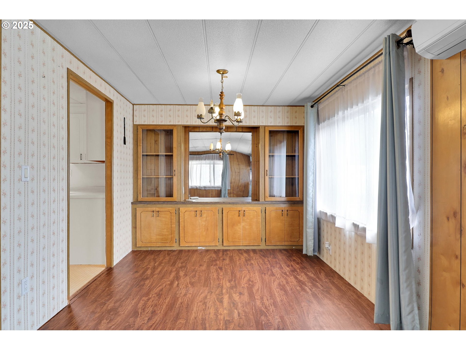 3900 Coburg Road, Unit 59 Eugene, OR 97408 - Photo 8 of 30 a open kitchen with a dishwasher cabinets and a wooden floor