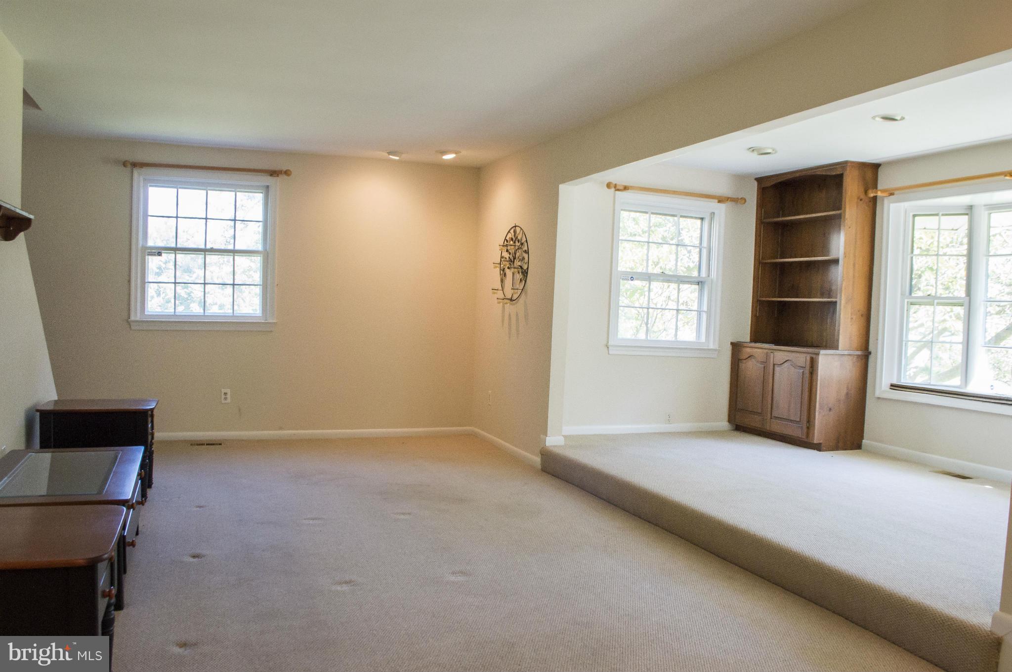 2050 Holland Cliffs Road Huntingtown, MD 20639 - Photo 17 of 29 a view of an empty room with a window