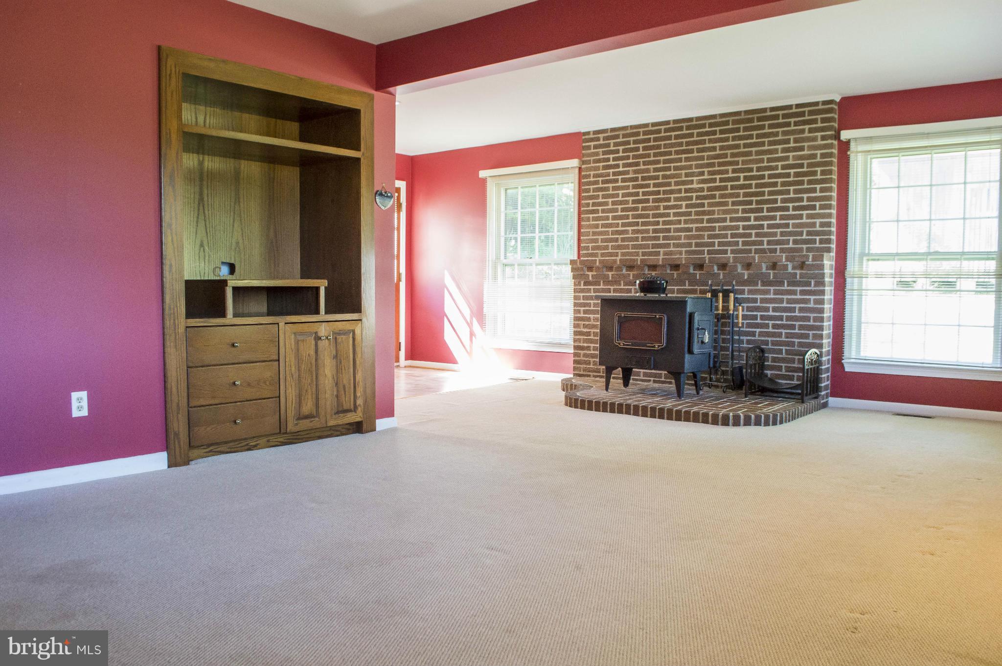 2050 Holland Cliffs Road Huntingtown, MD 20639 - Photo 19 of 29 a view of a livingroom with a fireplace