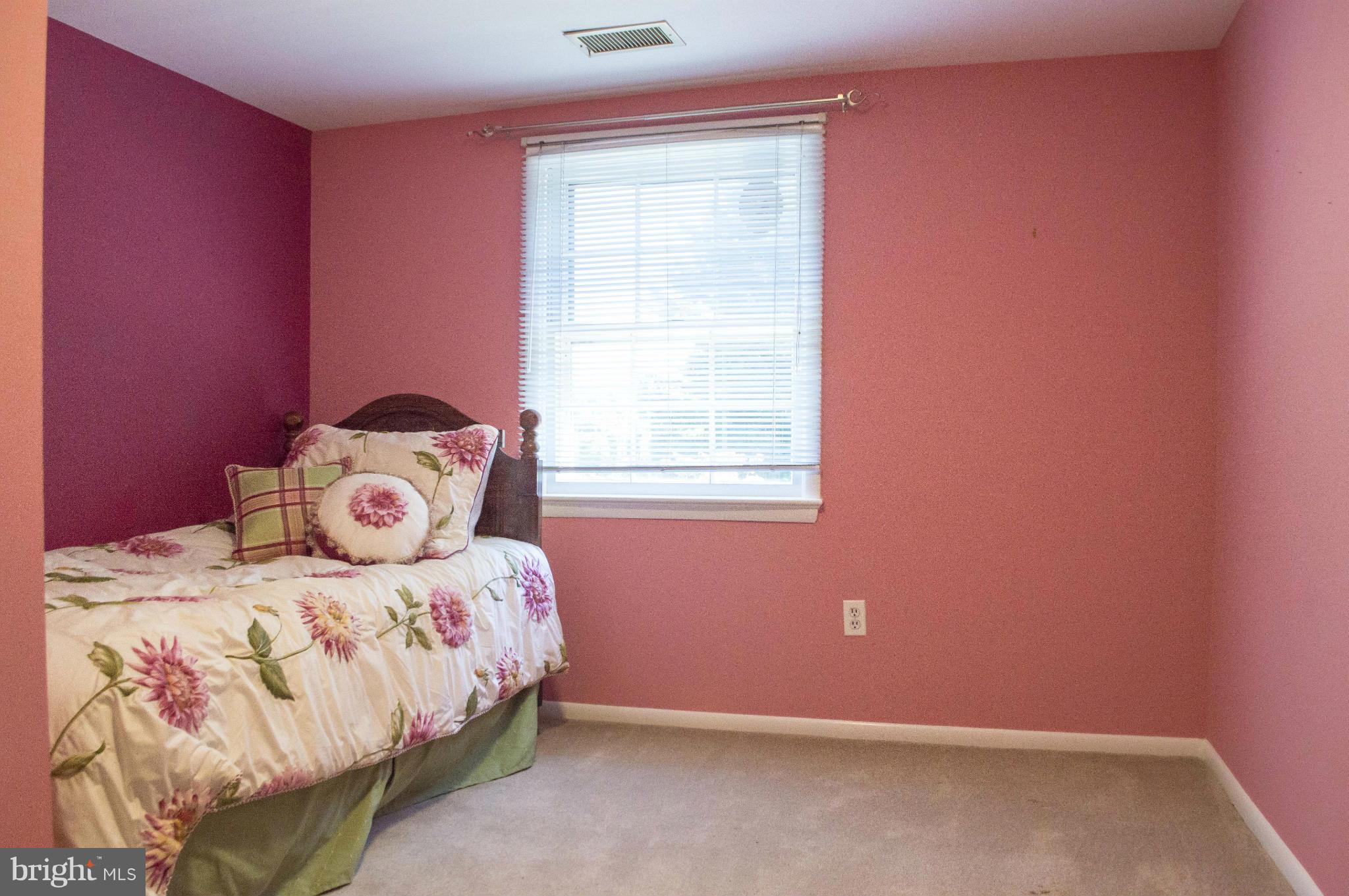 2050 Holland Cliffs Road Huntingtown, MD 20639 - Photo 21 of 29 a bedroom with a bed and a window