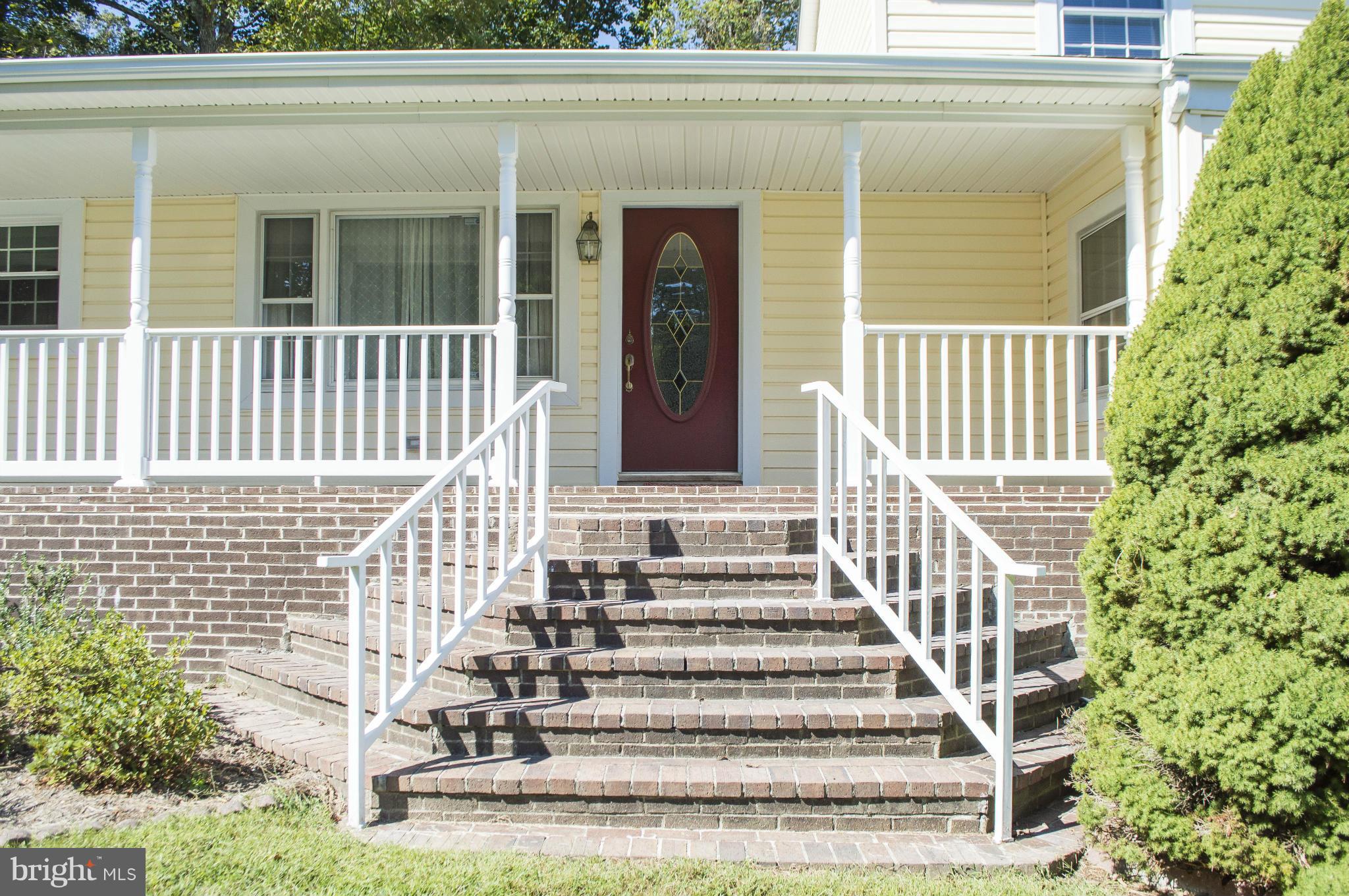 2050 Holland Cliffs Road Huntingtown, MD 20639 - Photo 7 of 29 a view of a house with a porch