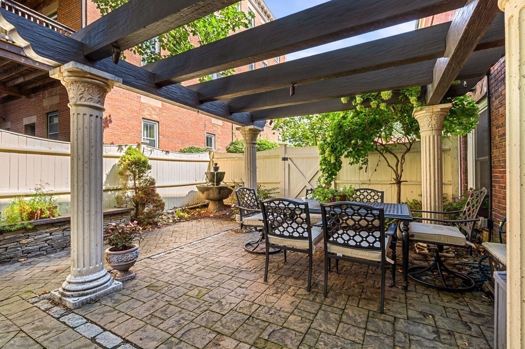 10 Forrester Street, Unit 2 Salem, MA 01970 - Photo 1 of 40 a view of a patio with table and chairs and potted plants