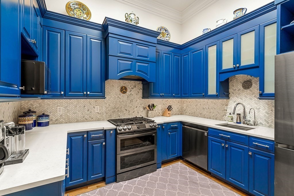 10 Forrester Street, Unit 2 Salem, MA 01970 - Photo 13 of 40 a kitchen with stainless steel appliances granite countertop a sink stove and cabinets