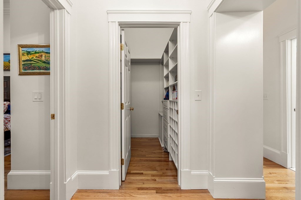 10 Forrester Street, Unit 2 Salem, MA 01970 - Photo 20 of 40 a view of a hallway with wooden floor and staircase