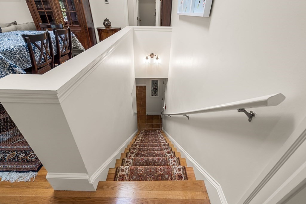 10 Forrester Street, Unit 2 Salem, MA 01970 - Photo 22 of 40 a view of a hallway with wooden floor and staircase