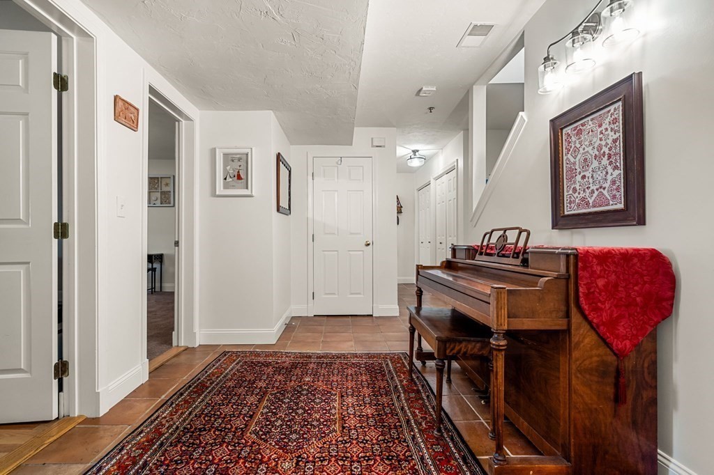 10 Forrester Street, Unit 2 Salem, MA 01970 - Photo 25 of 40 a view of a hallway with furniture and wooden floor