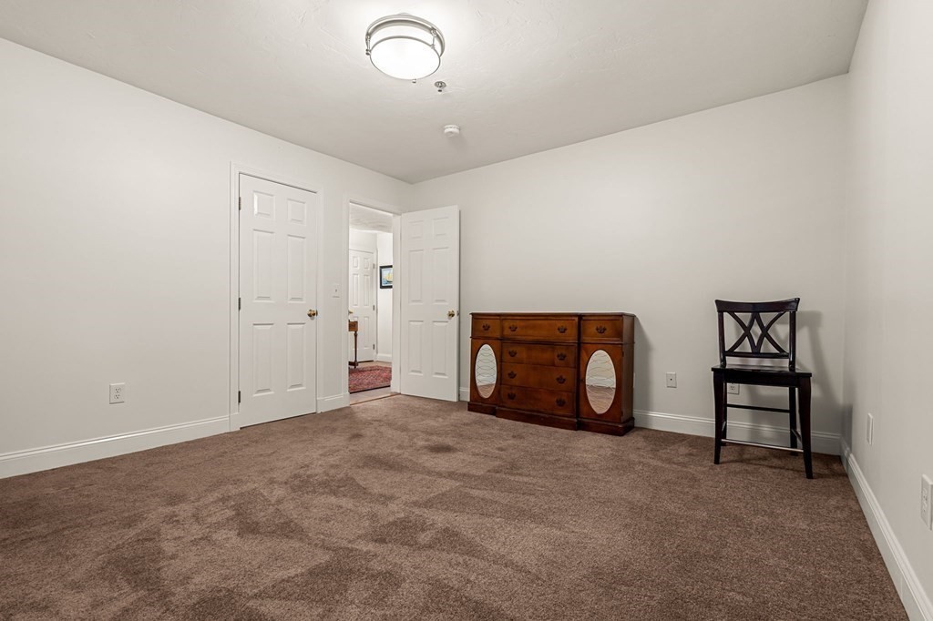 10 Forrester Street, Unit 2 Salem, MA 01970 - Photo 27 of 40 an empty room with furniture and fireplace