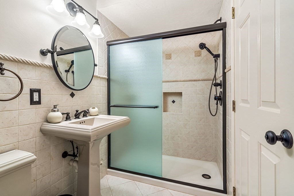 10 Forrester Street, Unit 2 Salem, MA 01970 - Photo 29 of 40 a bathroom with a sink toilet and a mirror