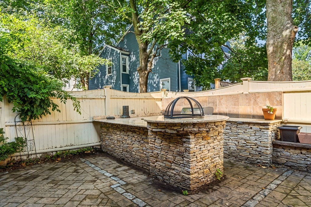 10 Forrester Street, Unit 2 Salem, MA 01970 - Photo 34 of 40 a view of a large yard with plants and large trees