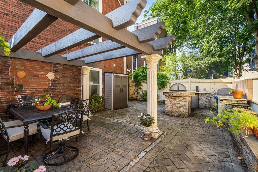 10 Forrester Street, Unit 2 Salem, MA 01970 - Photo 35 of 40 a backyard of a house with barbeque oven table and chairs