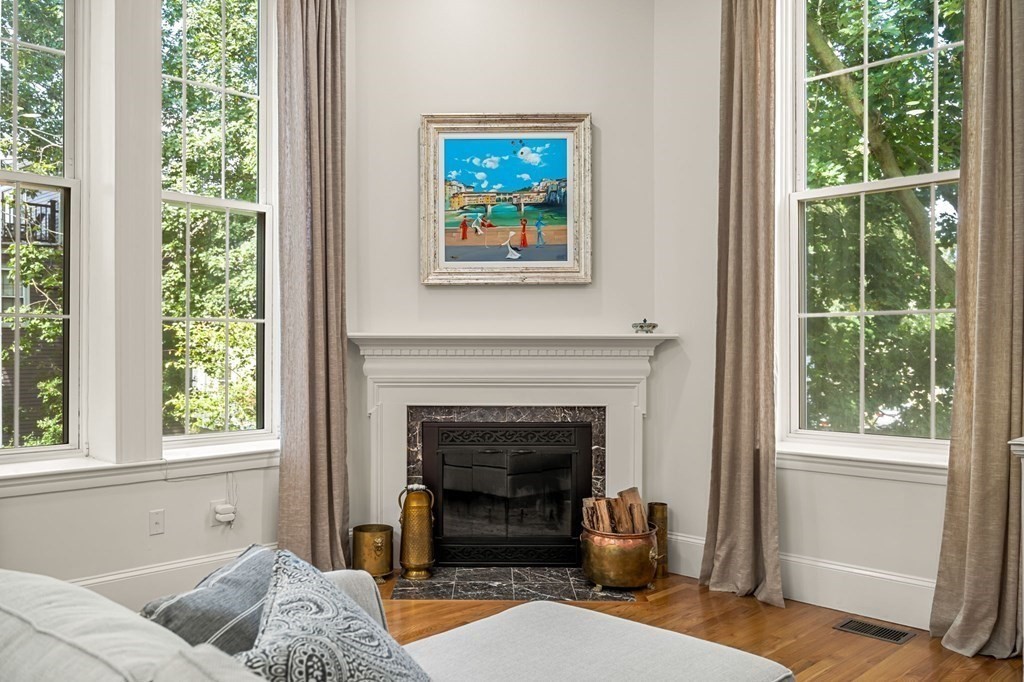 10 Forrester Street, Unit 2 Salem, MA 01970 - Photo 5 of 40 a living room with furniture a window and a fireplace