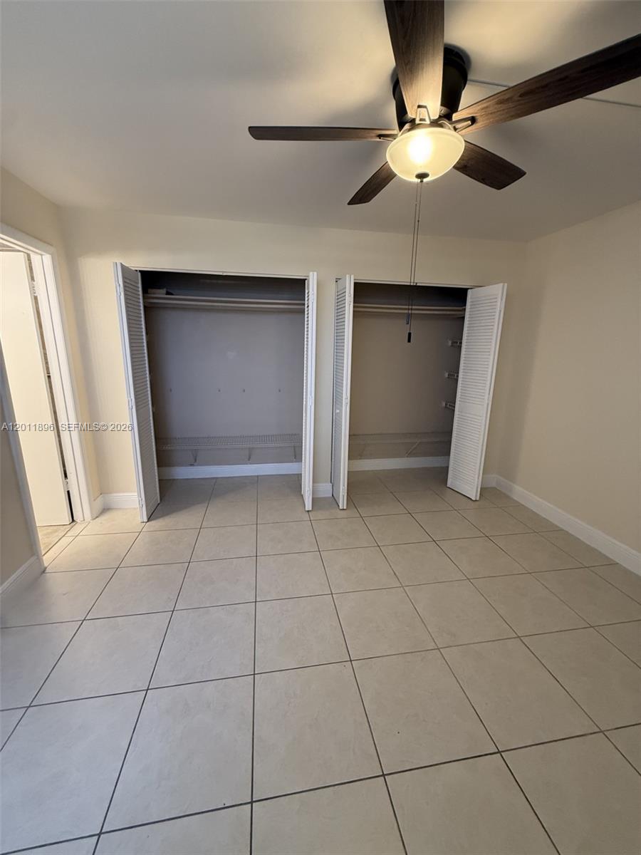 9411 Southwest 4th Street, Unit 111 Miami, FL 33174 - Photo 13 of 20 a view of an empty room with a window