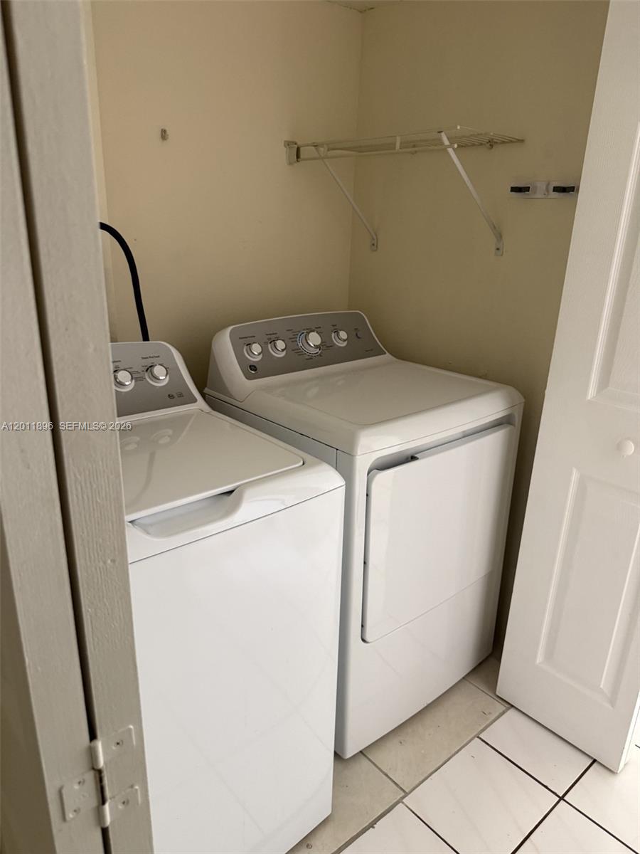 9411 Southwest 4th Street, Unit 111 Miami, FL 33174 - Photo 14 of 20 a utility room with dryer and washer