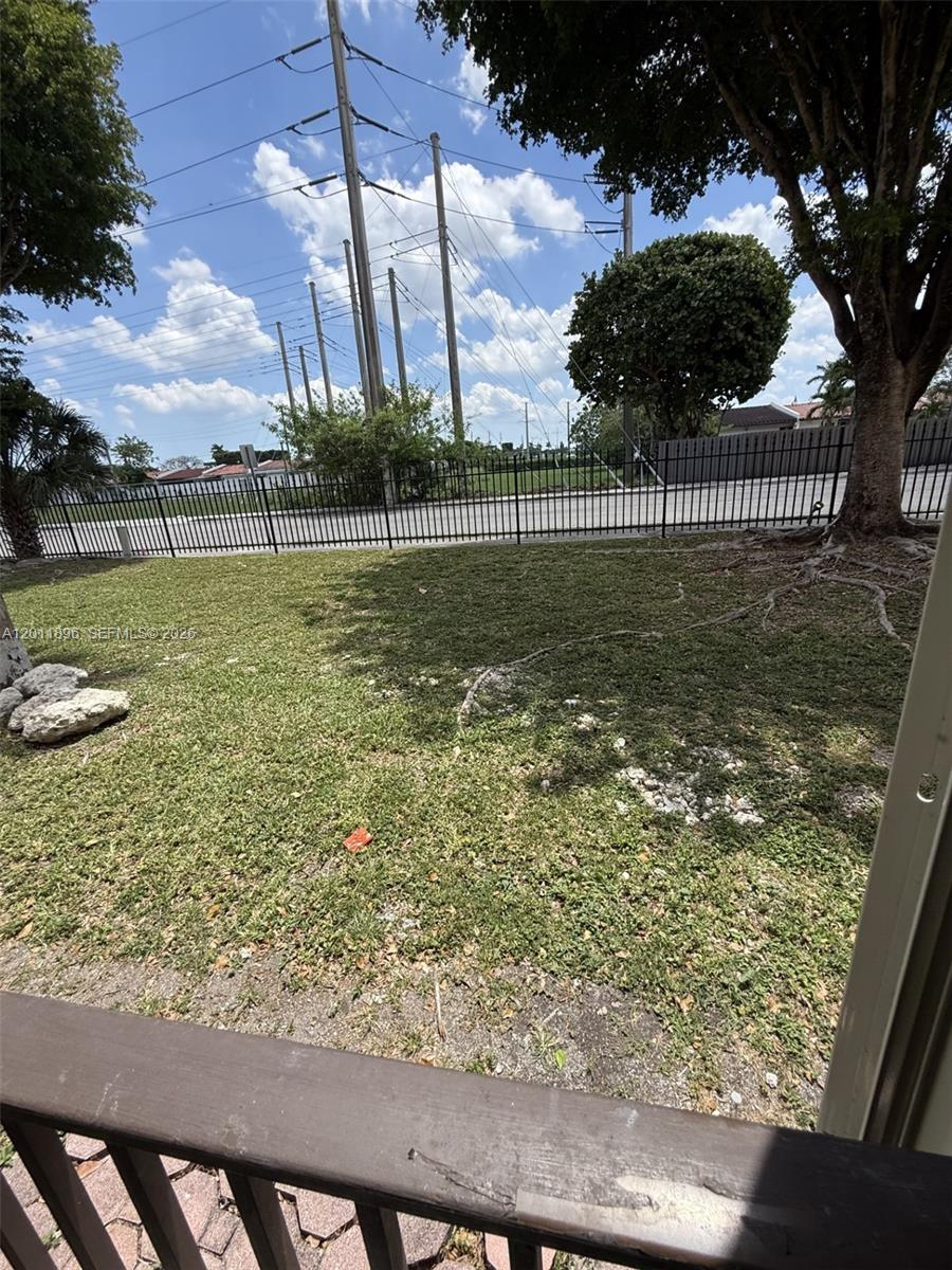 9411 Southwest 4th Street, Unit 111 Miami, FL 33174 - Photo 16 of 20 a view of a garden from a balcony