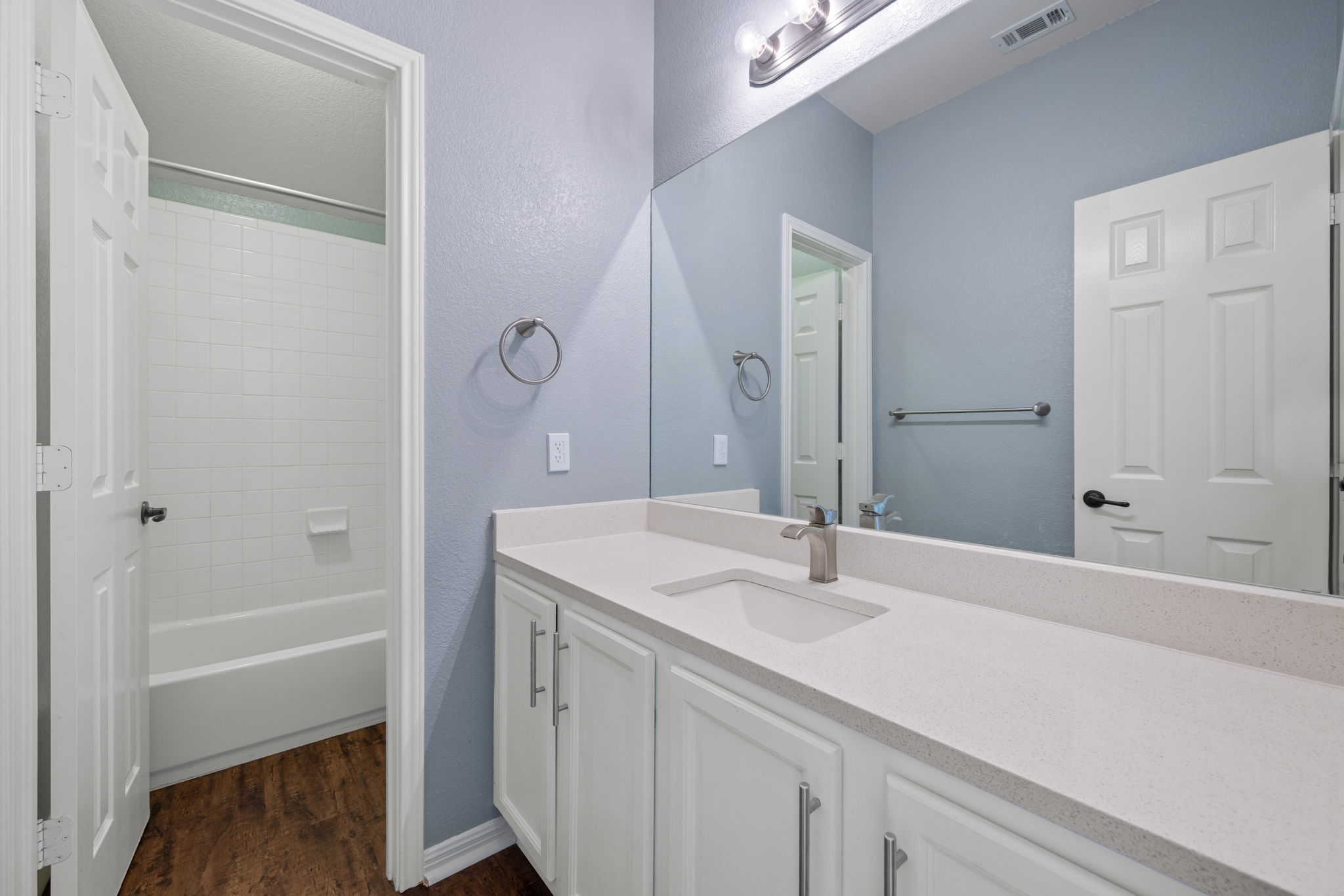 8902 Magna Carta Loop, Unit 122 Austin, TX 78754 - Photo 25 of 39 A well-appointed bath features a sleek vanity and convenient shower/tub combination.