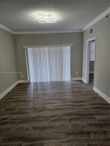 a view of room with wooden floor