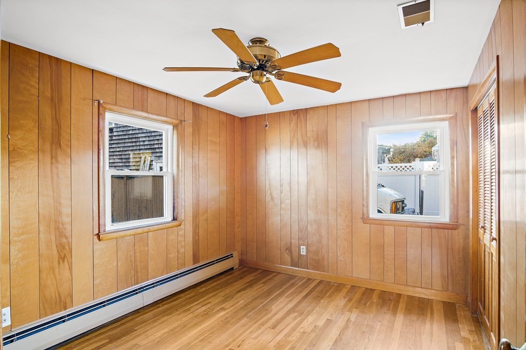 7 Roland Road Peabody, MA 01960 - Photo 15 of 24 an empty room with wooden floor windows and fan
