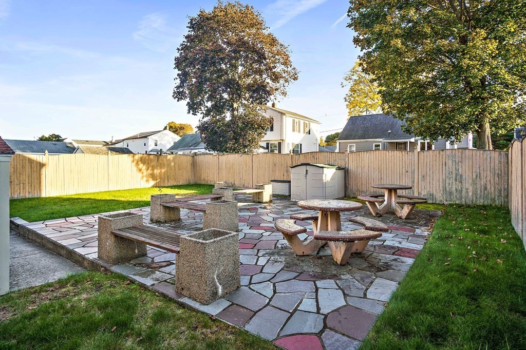 7 Roland Road Peabody, MA 01960 - Photo 2 of 24 a view of a backyard with sitting area