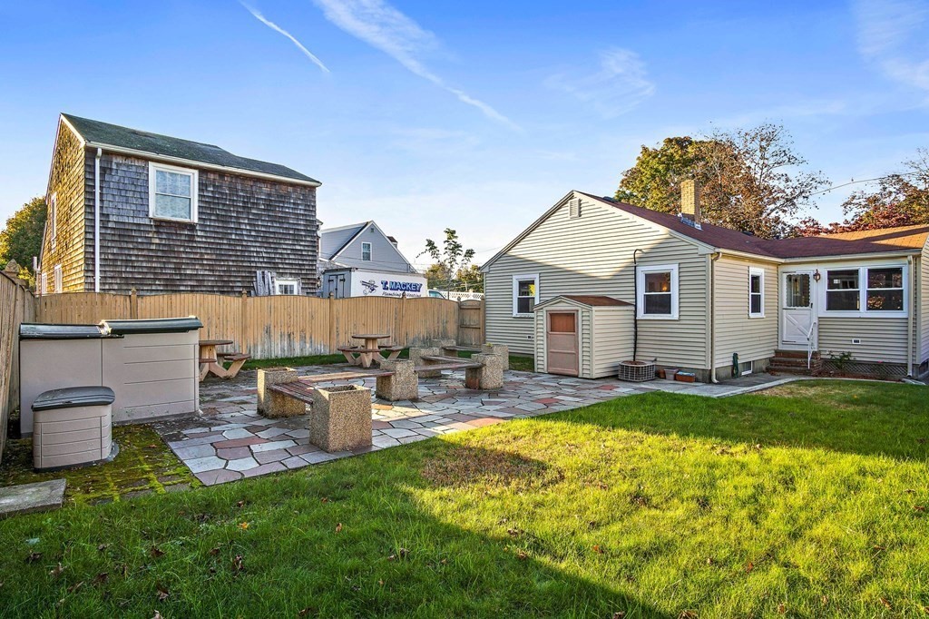 7 Roland Road Peabody, MA 01960 - Photo 22 of 24 a view of a house with swimming pool and a yard