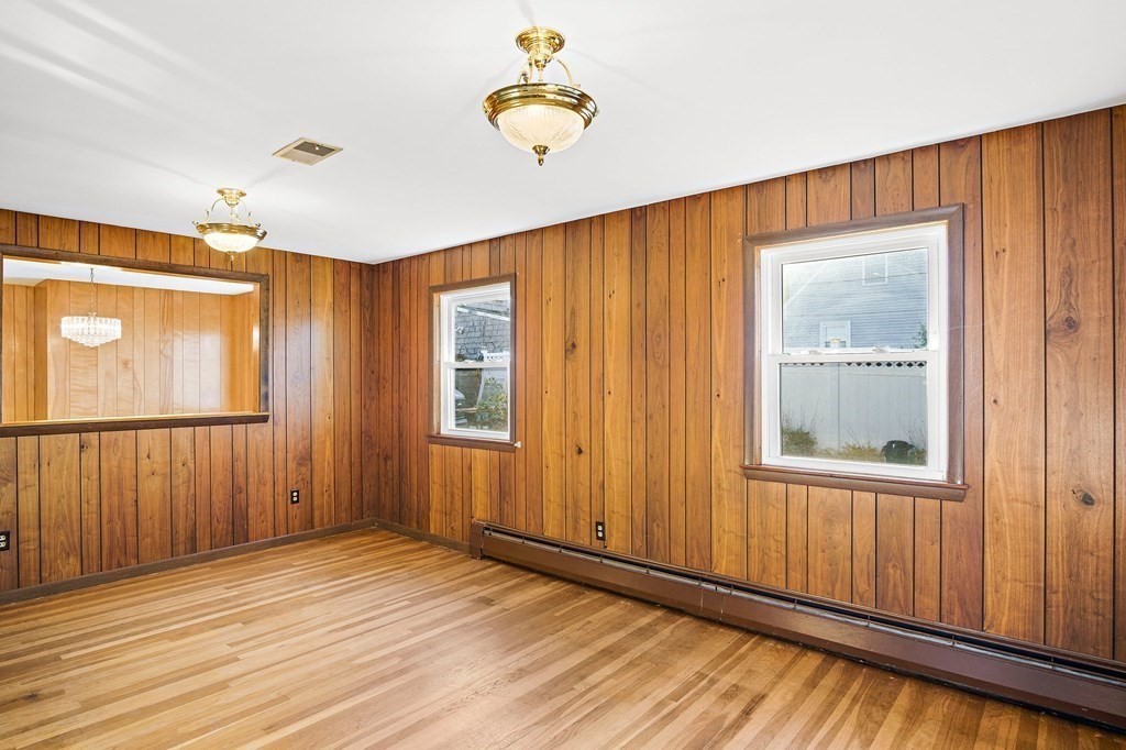 7 Roland Road Peabody, MA 01960 - Photo 4 of 24 wooden floor in an empty room with a window