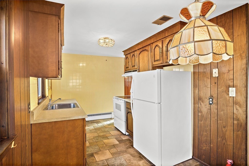 7 Roland Road Peabody, MA 01960 - Photo 9 of 24 a utility room with dryer and washer