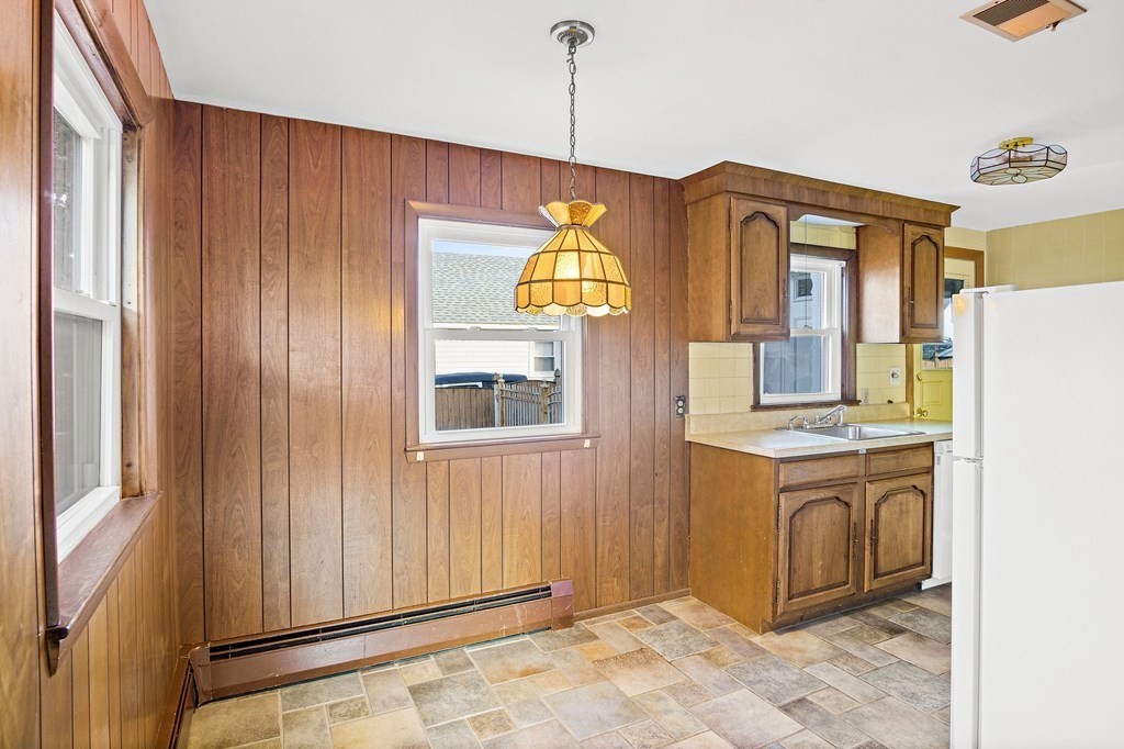 7 Roland Road Peabody, MA 01960 - Photo 10 of 24 a front view of a house with a yard