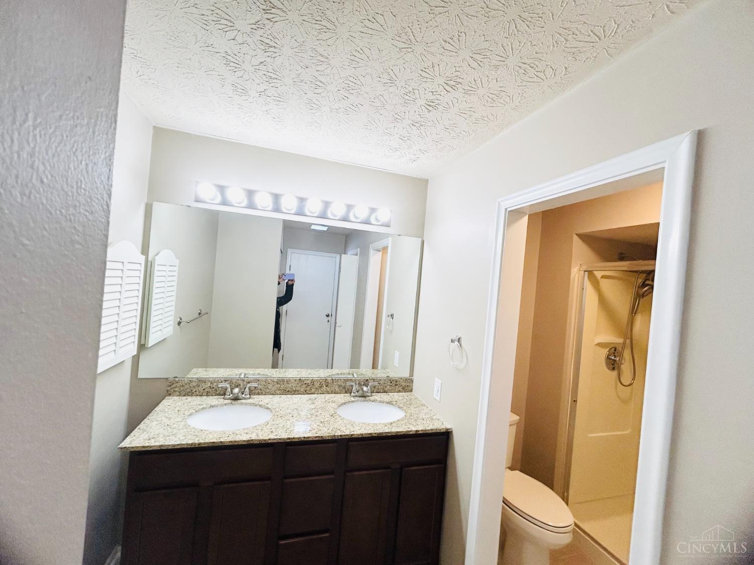 8122 Timbertree Way Beckett Ridge, OH 45069 - Photo 16 of 36 Full master bathroom recently upgraded with tile floor, double sinks vanity with granite countertop.