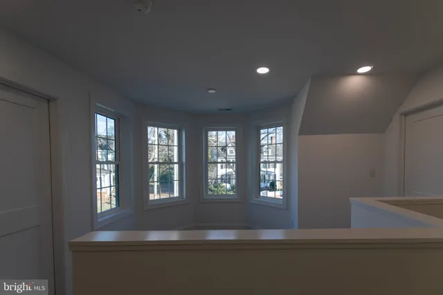 a view of an entryway with wooden floor