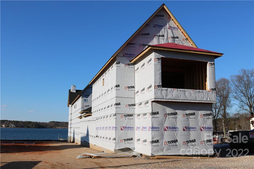 17819 Largo Place Cornelius, NC 28031 - Photo 10 of 11 a view of building with wooden stairs and potted plants