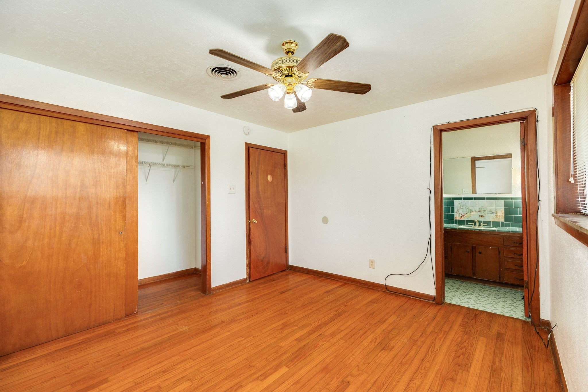 3702 Cedar Rapids Parkway Iowa Colony, TX 77583 - Photo 11 of 31 wooden floor in an empty room with a window