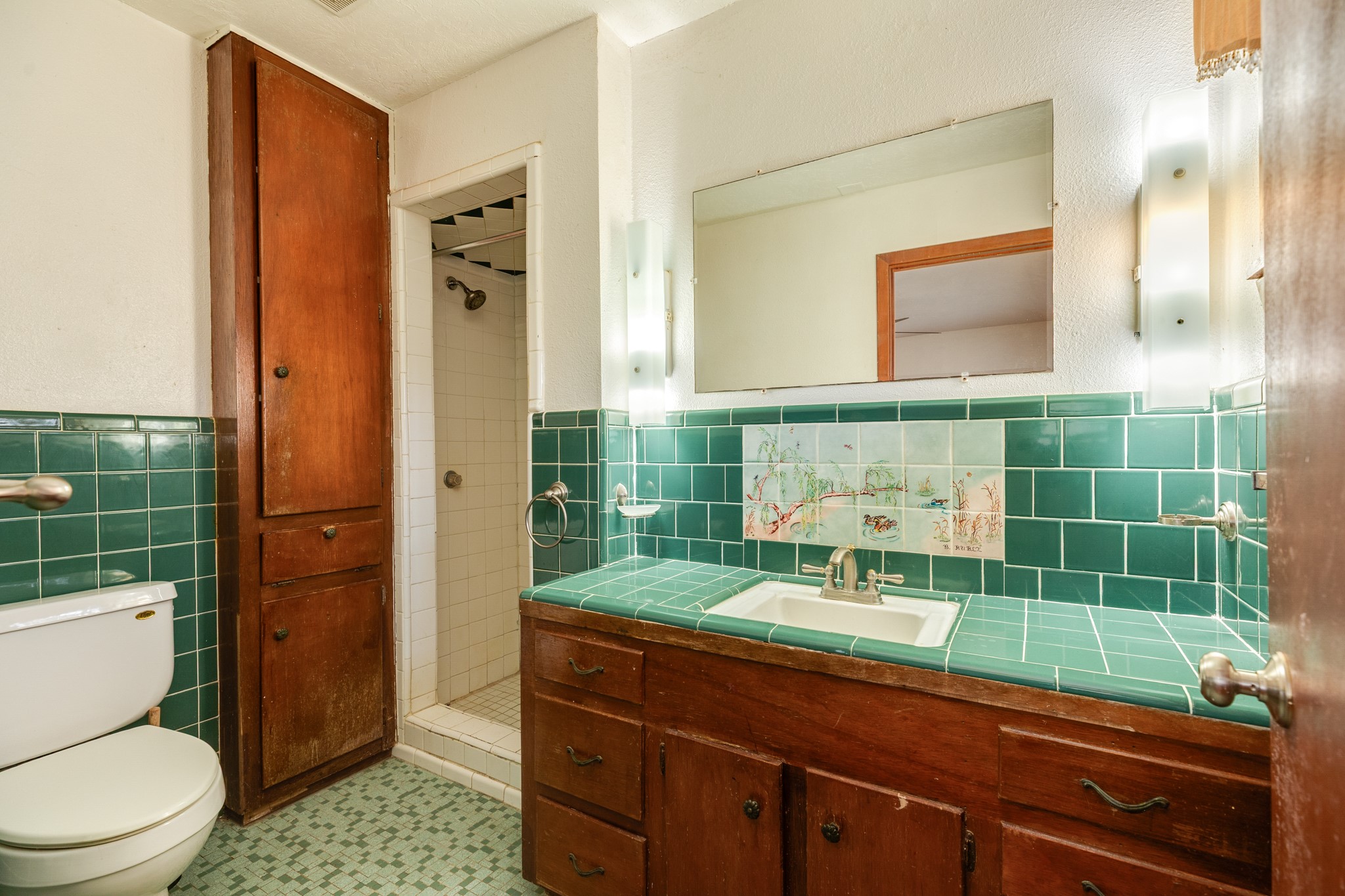 3702 Cedar Rapids Parkway Iowa Colony, TX 77583 - Photo 12 of 31 a bathroom with a toilet a sink and shower