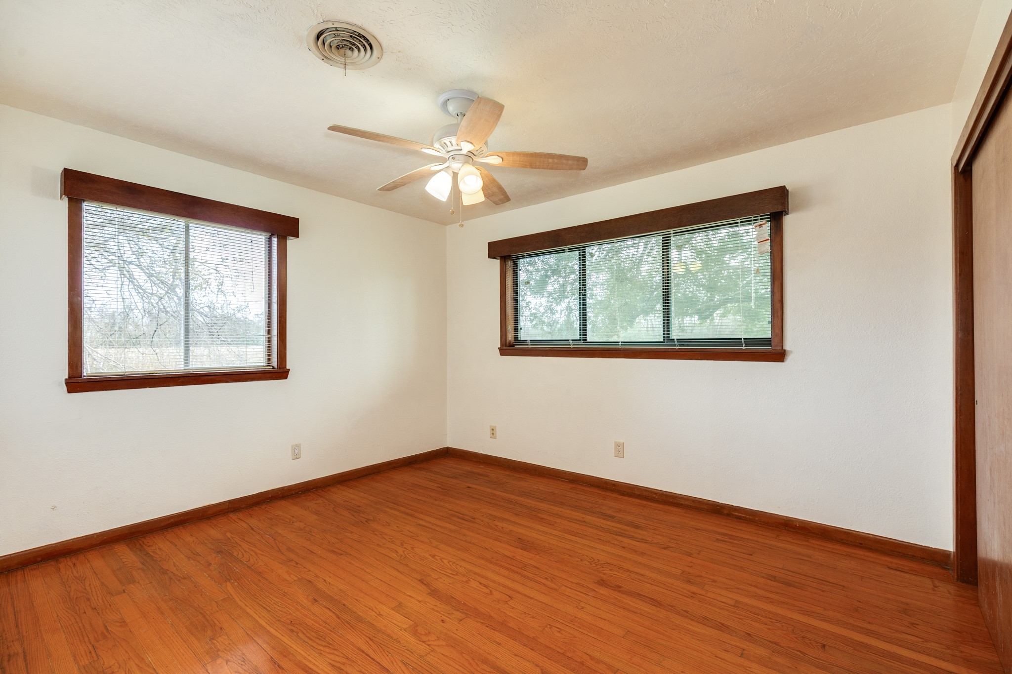 3702 Cedar Rapids Parkway Iowa Colony, TX 77583 - Photo 14 of 31 a view of an empty room with wooden floor and a window