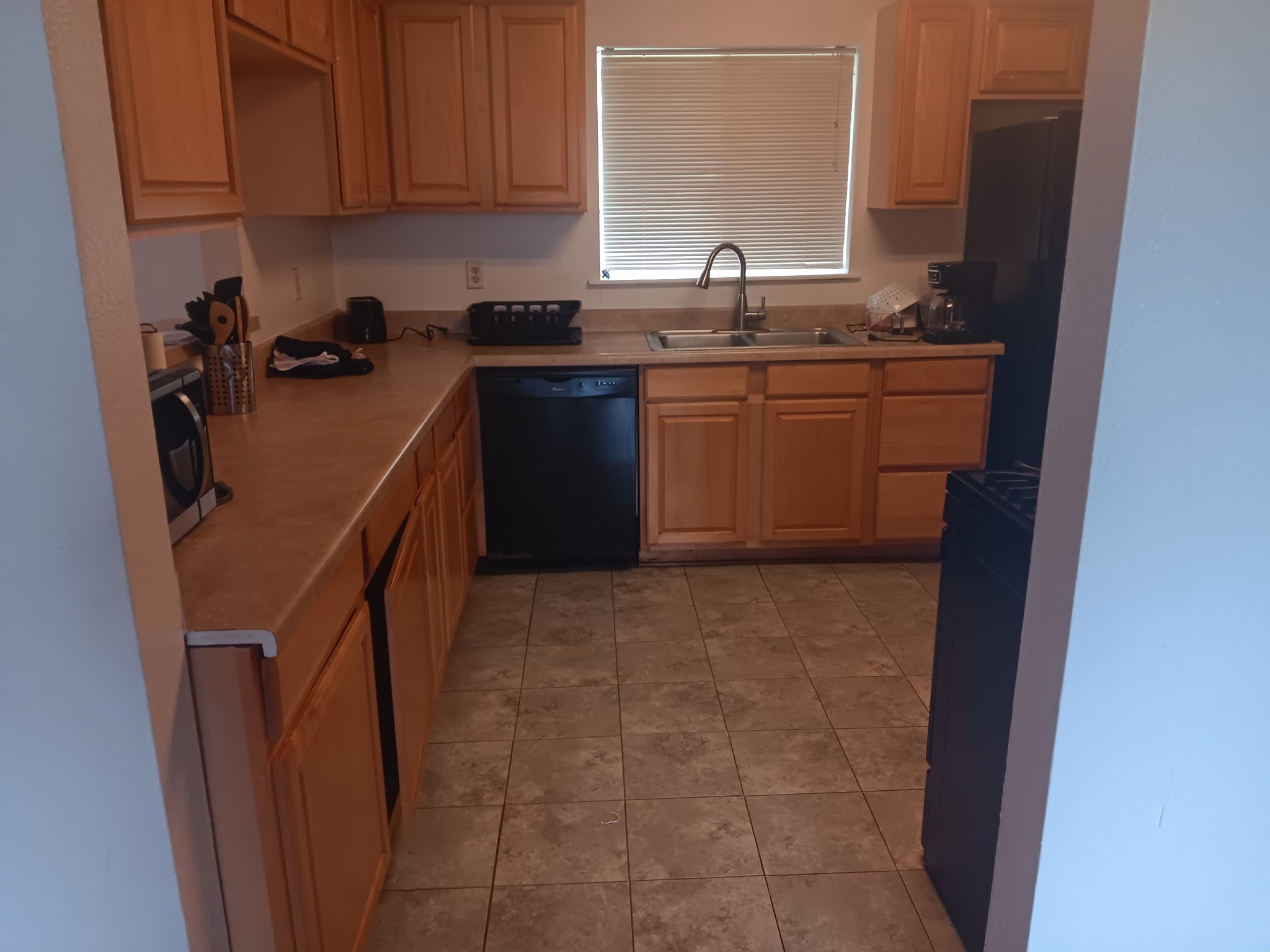 3702 Cedar Rapids Parkway Iowa Colony, TX 77583 - Photo 19 of 22 a kitchen with a sink a stove and cabinets