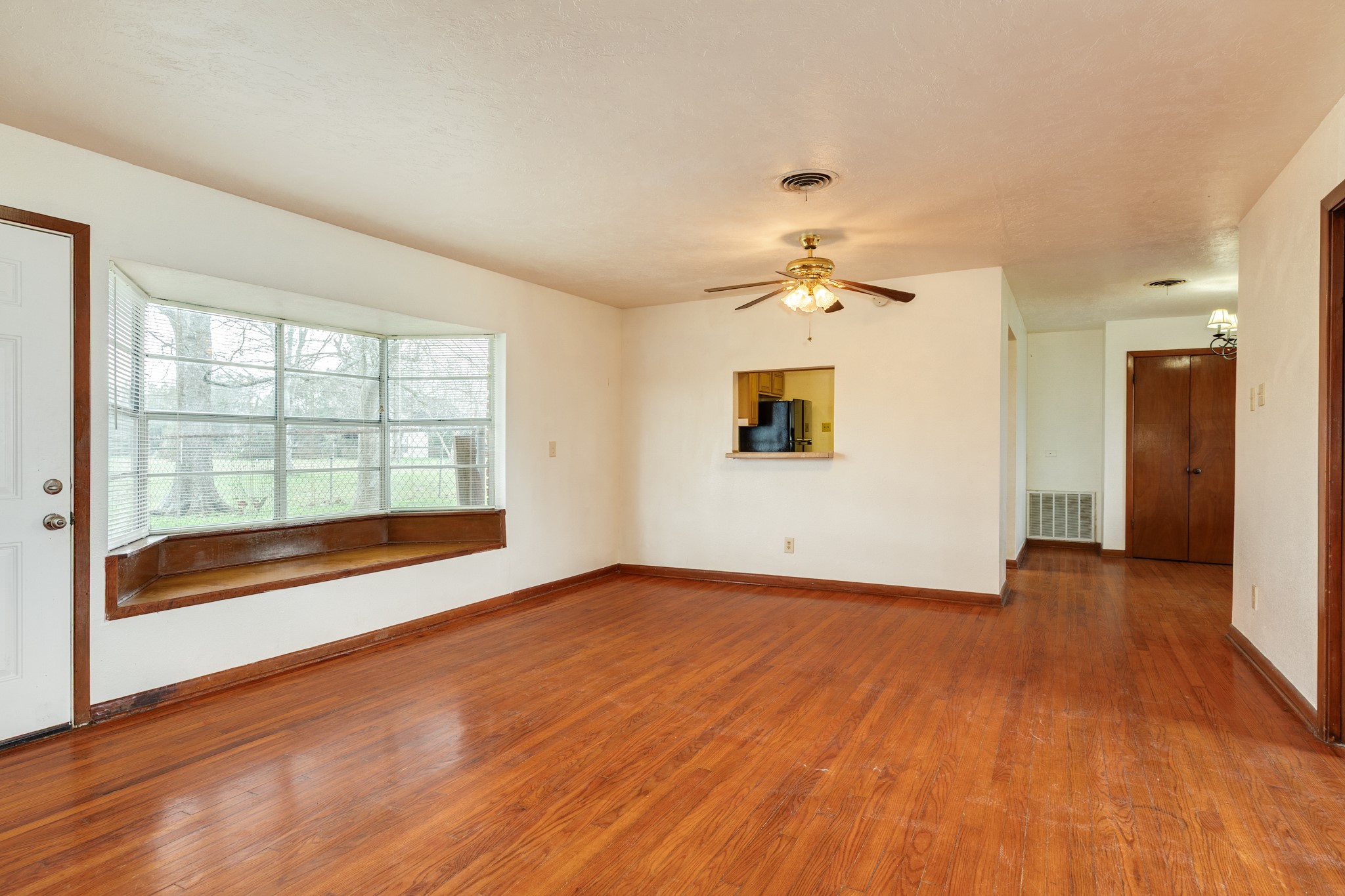 3702 Cedar Rapids Parkway Iowa Colony, TX 77583 - Photo 2 of 31 a view of an empty room with a window and wooden floor